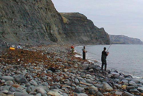Paul looks on while Nigel is oblivious.