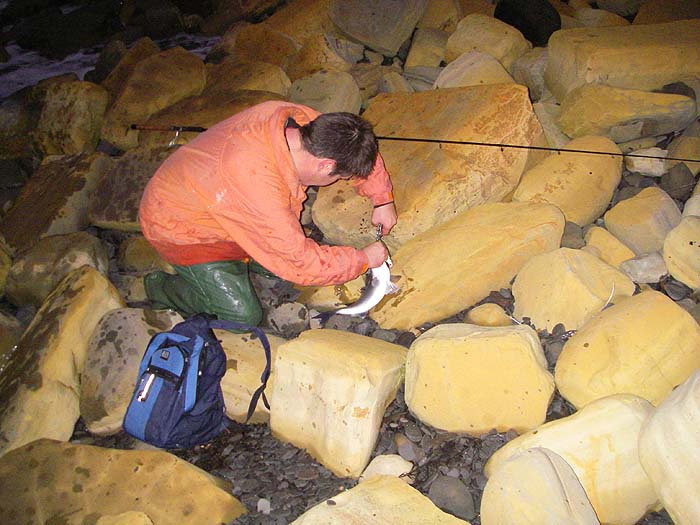Phil tries to avoid pinning himself to the fish as he unhooks it. The little ones don't half wriggle..