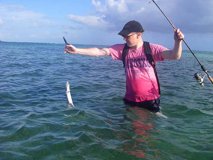 Richard about to pass the rod to me while he does the unhooking honours.
