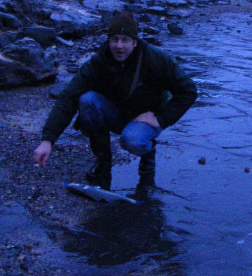 James slides his first bass ashore. Not my best ever photograph - it was darker than I thought.