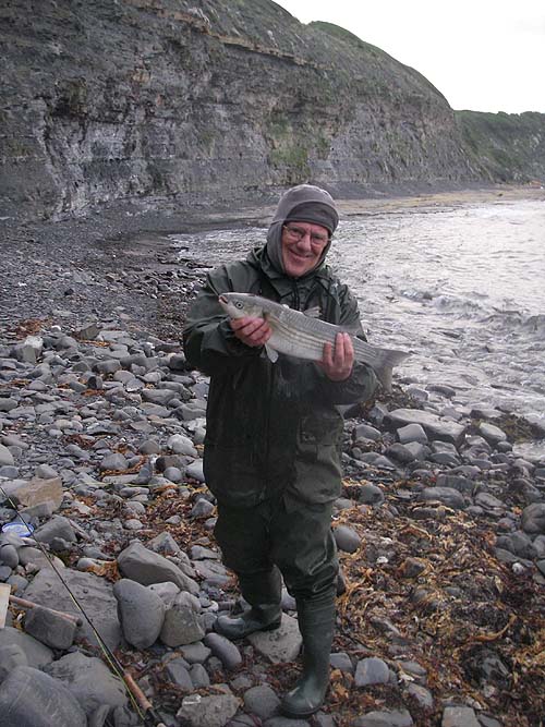 Ben was kind enough to take a picture of me with the fish before I returned it to the sea. It was hooked just where the waves are turning over in the edge.