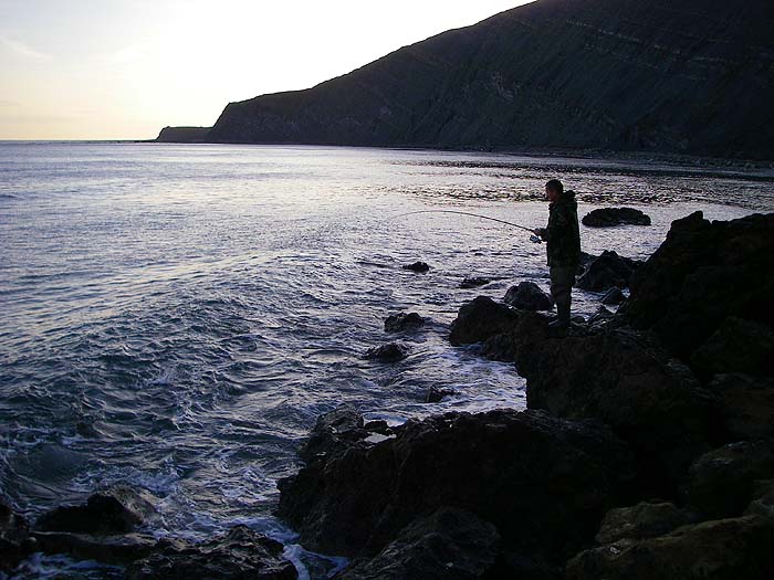 Dave plays his bass hooked from a high perch to avoid the waves. By now it was quite bright but my camera was facing into the light.
