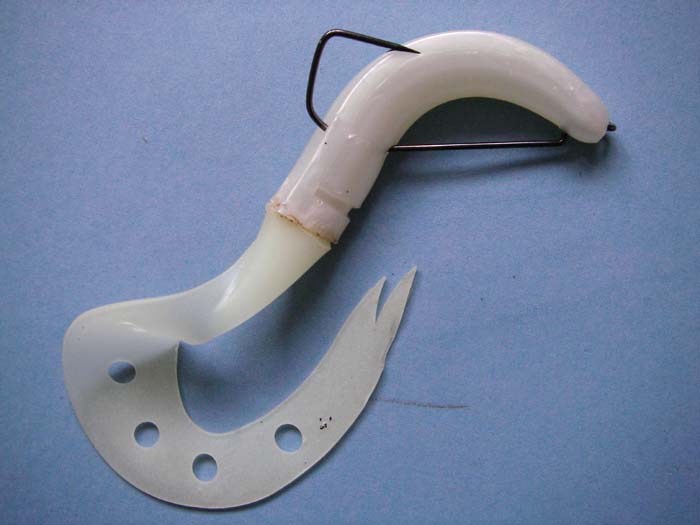 A bass is hooked and the lure has slid up the shank.