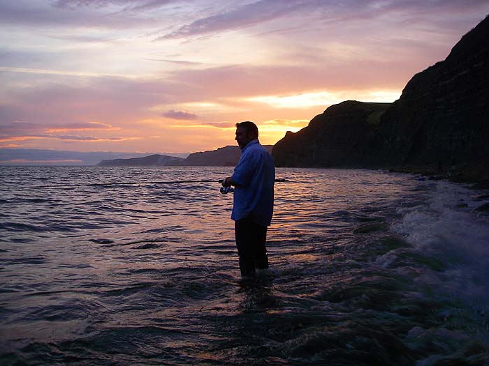 My second son Marc attempts to catch just one more bass as the sun sets.