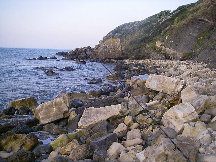 Scrambling about on the boulders in search of a bass. I was trying a slider with no joy.