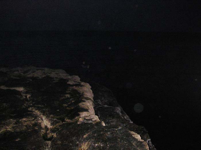 Even after a bit of 'brightening' it's still hard to pick out the figure of my pal casting his fly from the rocks.