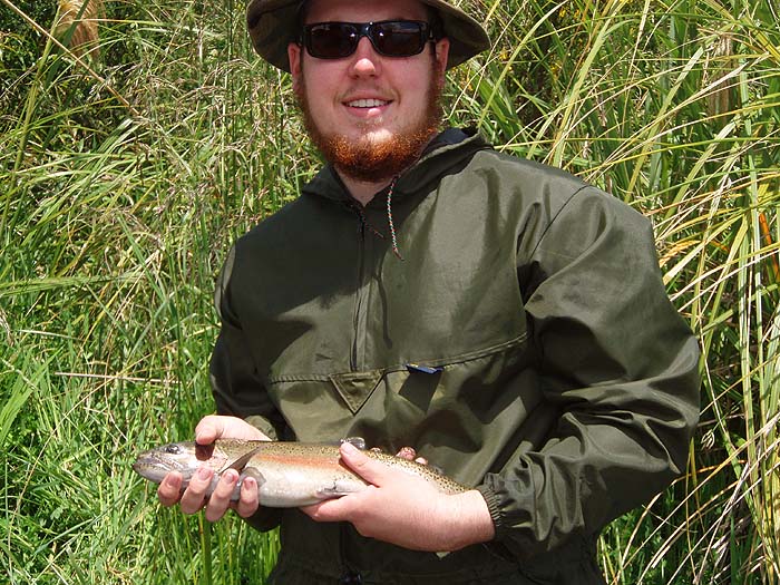 With his first fly-caught trout - good effort.