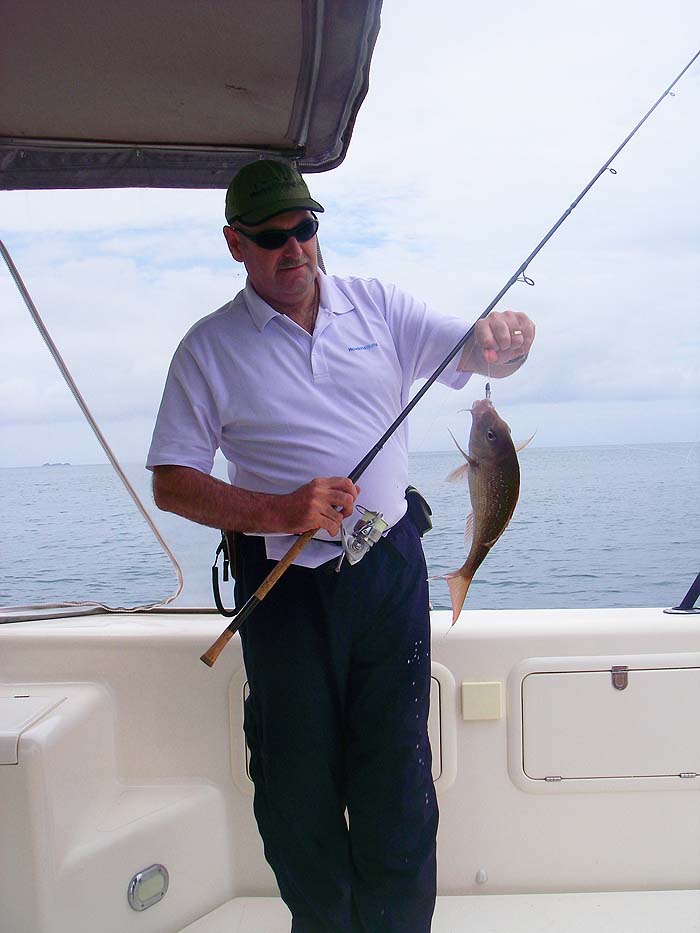 Alan with a snapper caught on a soft plastic with a leadhead. He's gradually perfecting the method.