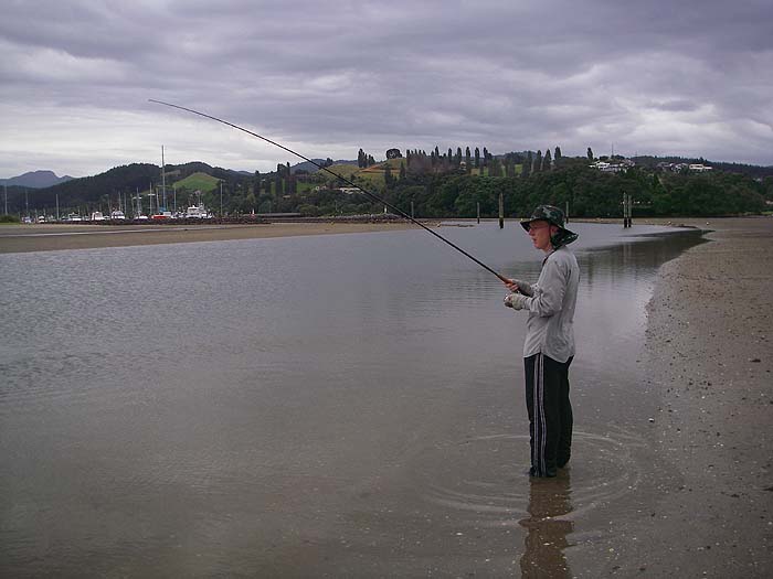 Richard into a kahawai in the main channel of the flats at Whangamata. Fish often tend to hold under the boats.