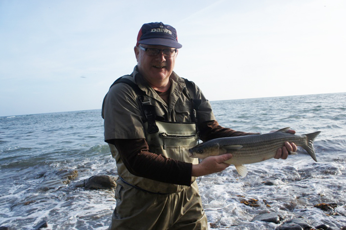 Nige looks well pleased with his five pounder landed (with a bit of help from Bill) despite the difficult conditions.'