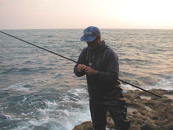 The fish is totally hidden in his hand.