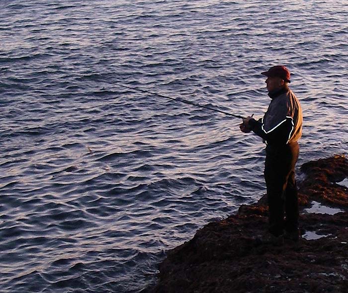 Flogging away in calm conditions but it's nearly time to pack in. As the sun rises the fish go.