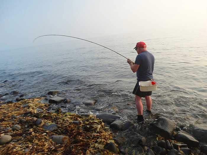 In the last stages of his battle with a big mullet.
