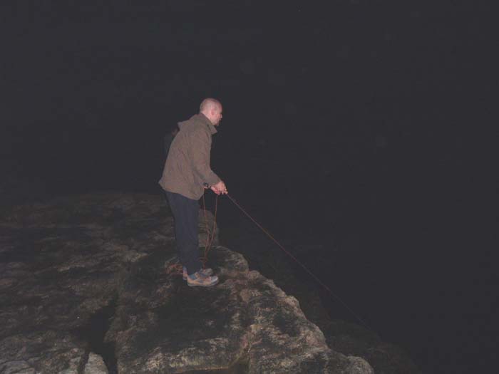 Brian and Steve (just visible behind him) wielding fly rods in the gloom