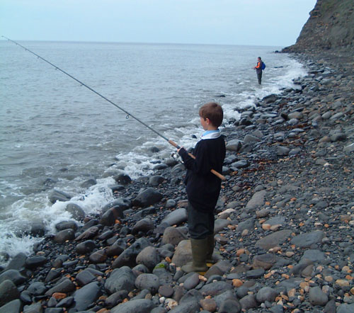Ben plugging away with David Baker in the background.