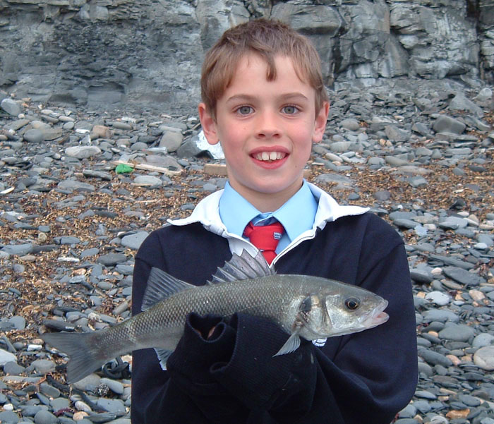 A bit spikey to pick up with the bare hands but ready to go back alive. Note the school shirt and tie under the borrowed rugby shirt. They all got saturated.