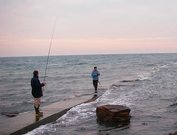 Phil's rod is well bent into his first bass caught on a lure (Chug Bug).