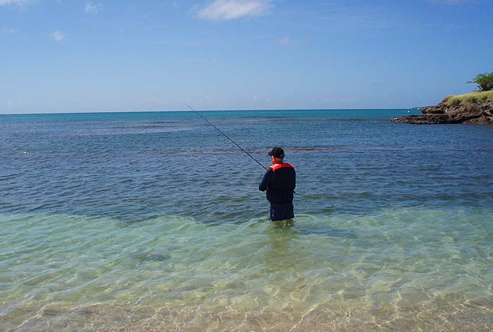 Note the buoyancy jacket - always reassuring when wading on unknown territory and good padding for the rods in the suitcase.