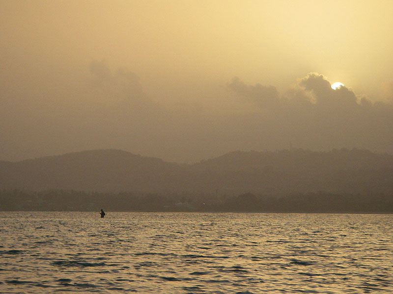 Spinning for bonefish at dawn - the haze is partly due to bush fires.