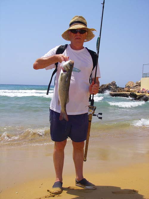 I'd have been lynched if I hadn't given this fish to one of the locals. I was casting from the rocks to my right - just past the sunbeds.
