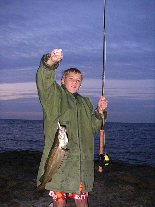 Not the biggest one he caught but by now it was light enough to take a reasonable picture. As I pressed the shutter the fish kicked and was just slipping down from his grasp.