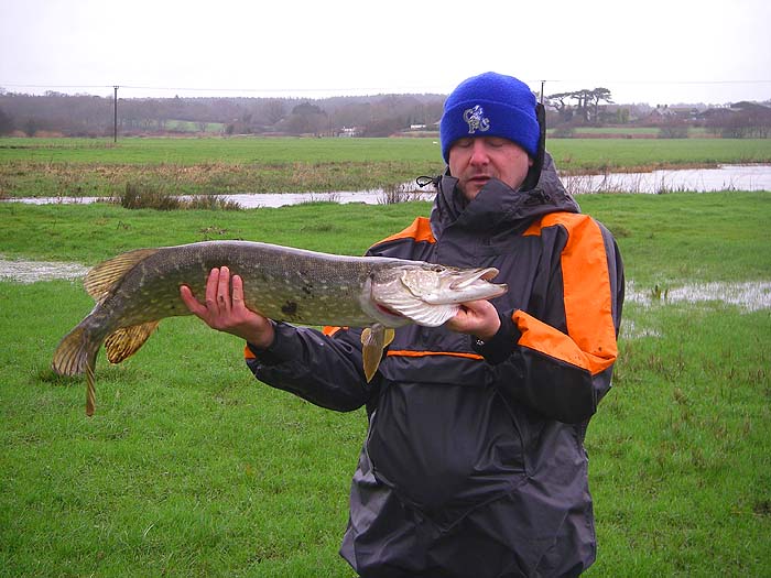 Despite the unpromising conditions a nice fish (even if Dave has nodded off).  The rain had just about stopped as well.
