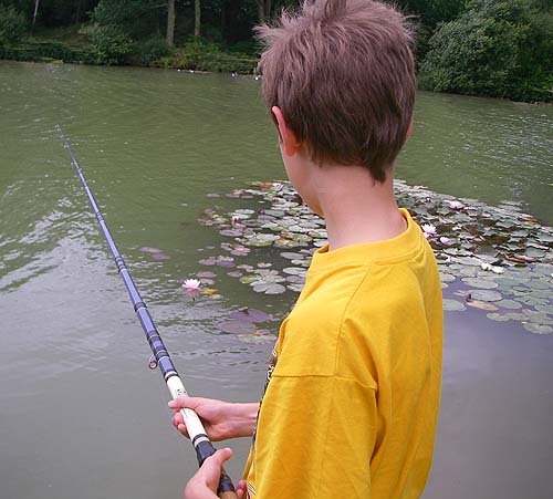 Ben, with my old rod, concentrating on his float.