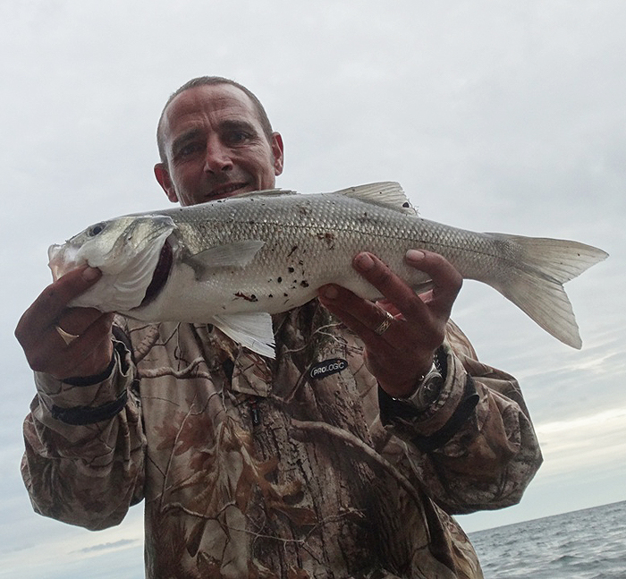 One of his many lure-caught bass.