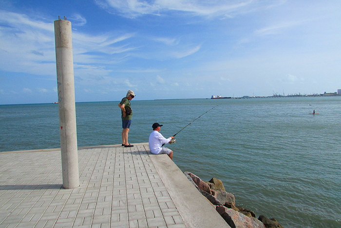 That's me questioning a local who was catching tiny catfish on bits of prawn.