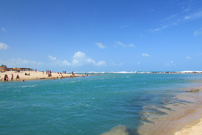 The tide ripped through here and MUST contain good fish at times.  Too many people!