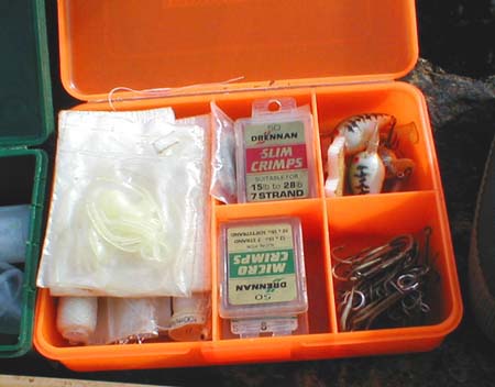 Crimps, fly tying materials, assorted trebles and a couple of ultra-light plugs (now rarely used).