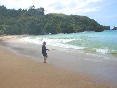 The sea is clear but note the heavy surf in the water's edge.